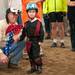 David Jessen, Ann Arbor, holds the hand of Jansen Sweeny, 6 of Belleville, at the Harold and Kay Peplau Therapeutic Riding Center's Halloween Trick-or-Treat horse ride. (Tanya Moutzalias for AnnArbor.com)